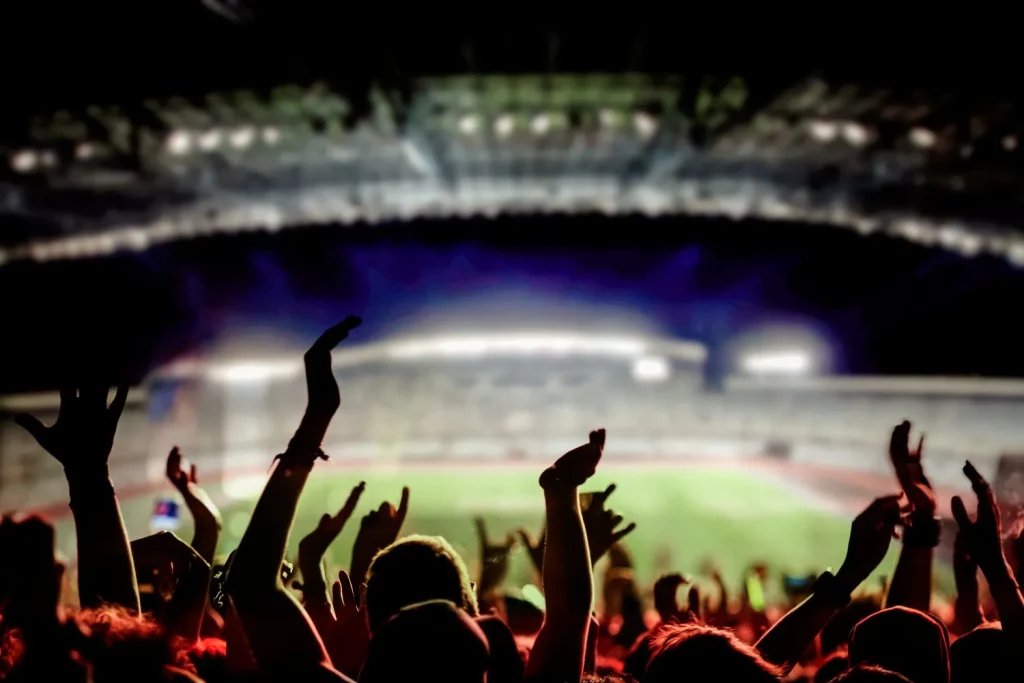 Fans im Stadion jubeln über Sportwetten ohne OASIS